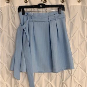 Pale blue skirt with faint white stripes